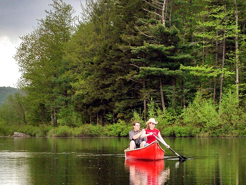 Couple canoeing on the river.